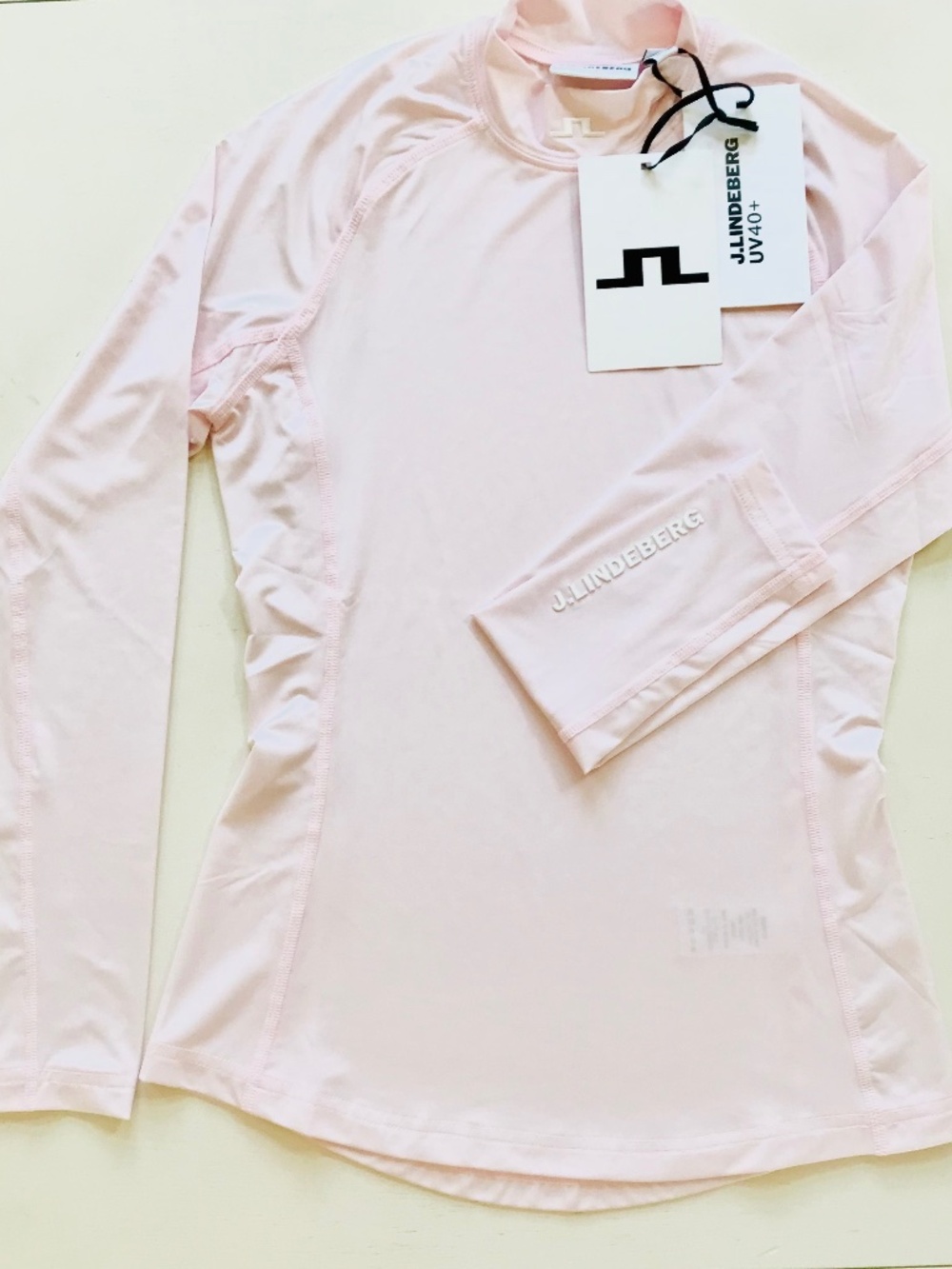 J. LINDEBERG SPRING 2027 BARELY PINK UV 40+ PROTECTIVE COMPRESSION TOP